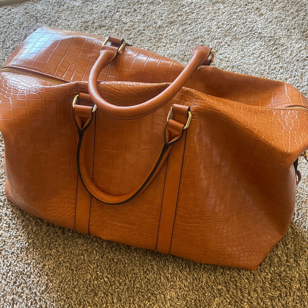 Brand new Louenhide duffel bag